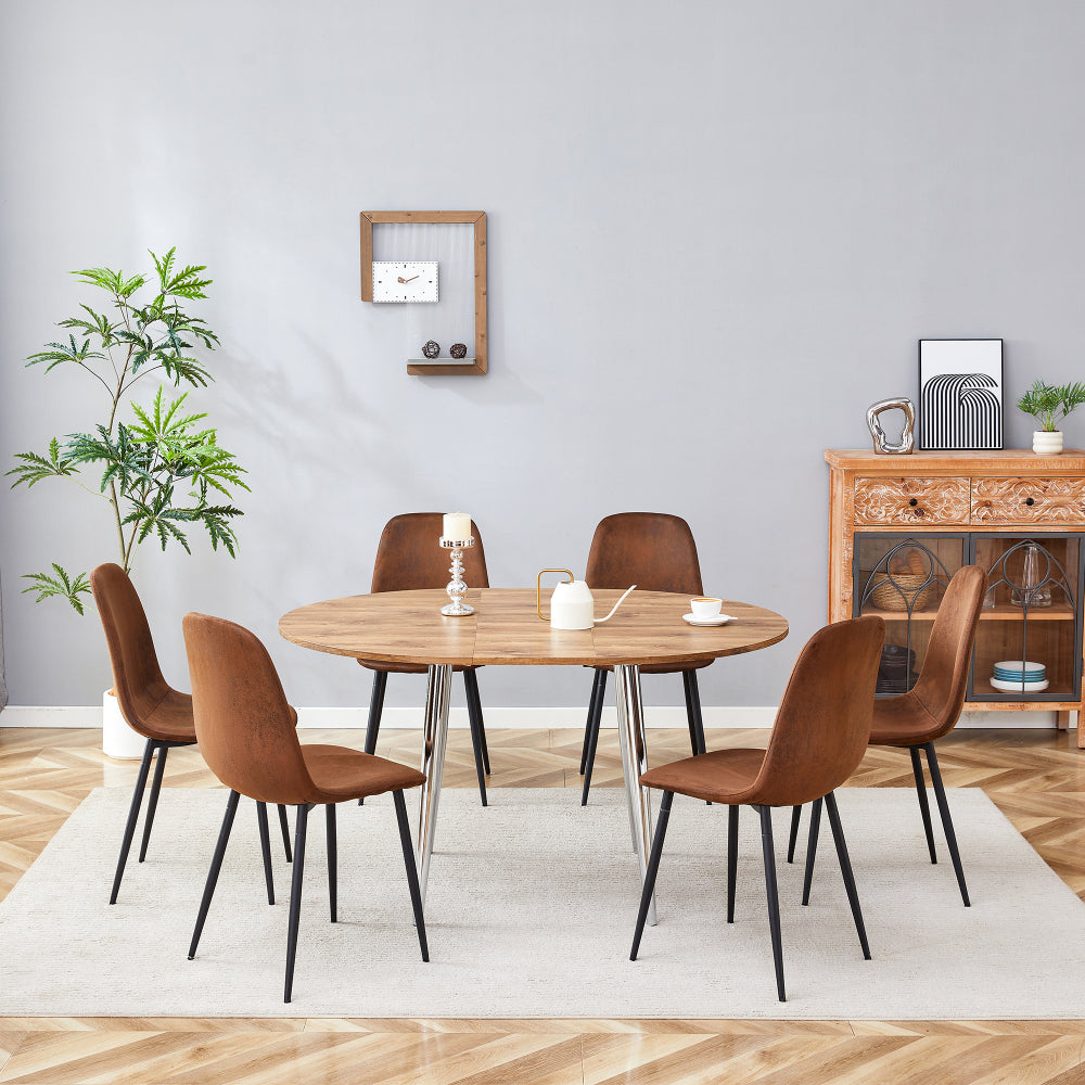 Table and chair set.With a Expandable mechanism,the Wood Grain MDF table top and silver metal legs and has a smooth surface.Paried With 6 chairs with soft suede cushions and black metal legs.