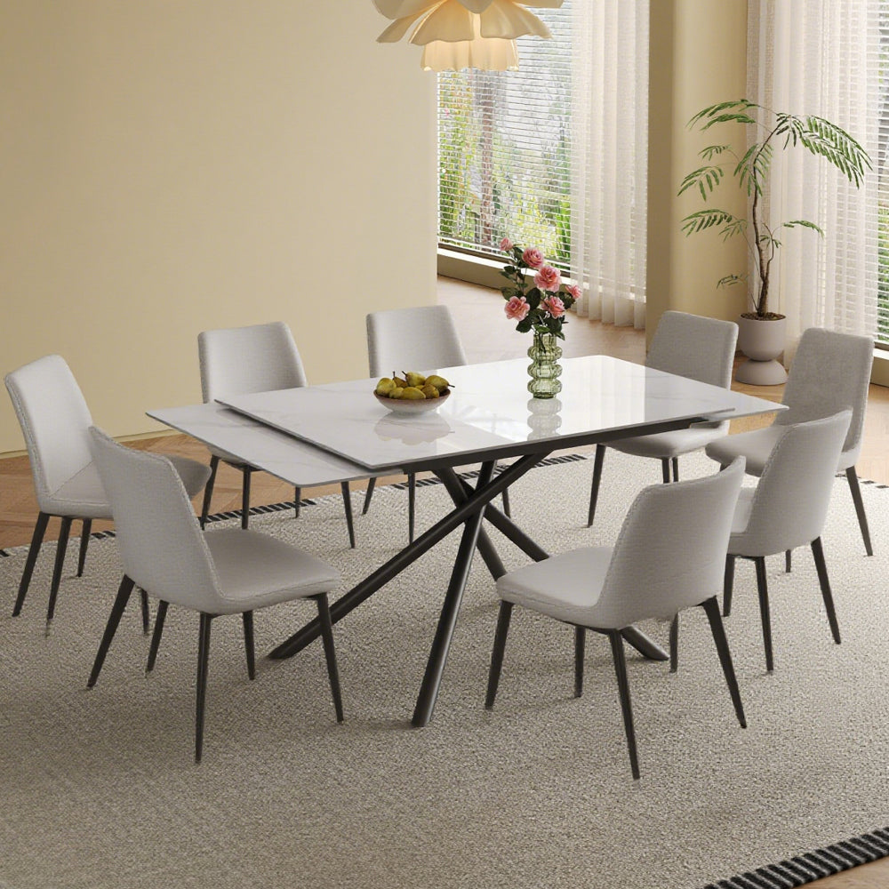 Retractable Sintered Stone Dining Table Set,It features a modern rectangular design, with black carbon steel table legs and a cross-leg structure at the bottom(Table + 4 Chairs)